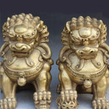 Deux-statues-lion-doré