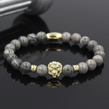 Bracelet avec perle et tete de lion