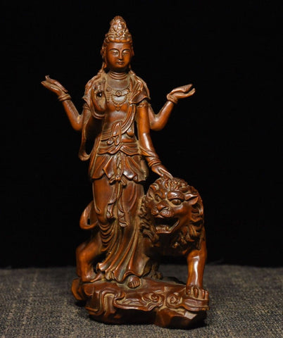 Statue-bois-lion-bouddha