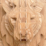 Tête de lion en bois.