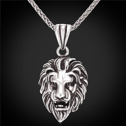Collier chaine argent avec tête de lion.