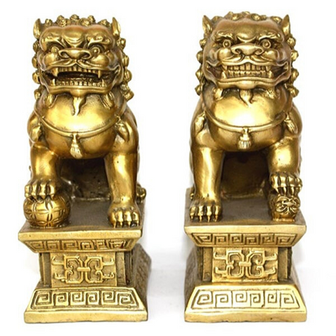 Couple statue lion chinois.