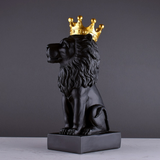 Statue lion noir et couronne or.