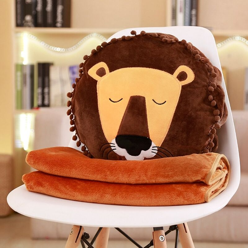 Peluche lion yeux fermés.