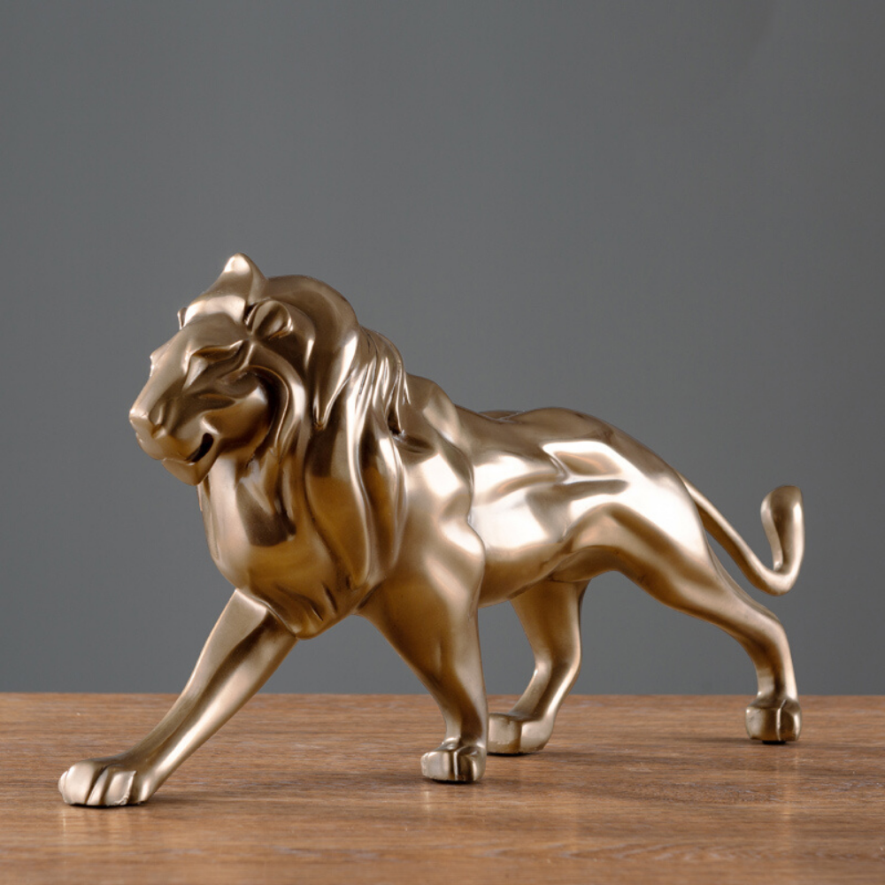 Statue lion doré déco.