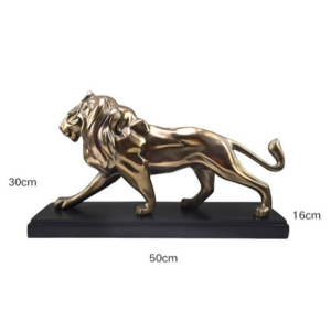 Statue lion dorée et noire.
