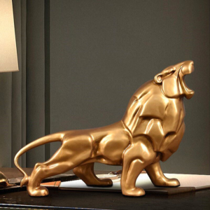 Statue lion couleur or.